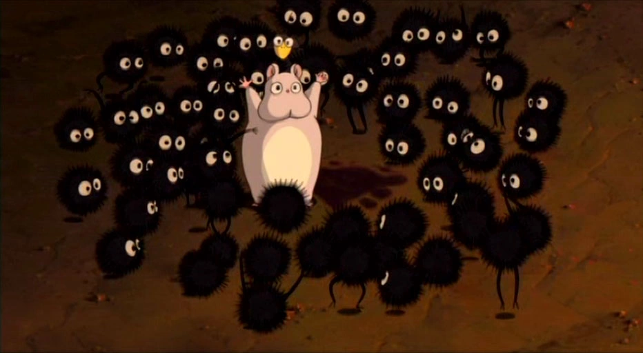 La mascota de Chihiro hablando con las pulgas negras.