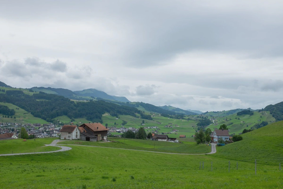 valley-fields-and-farms-near-appenzell-cloudy.webp