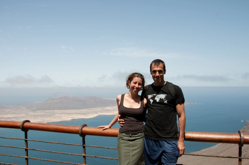 young-couple-on-balcony-in-front-of-atlantic-ocean.webp
