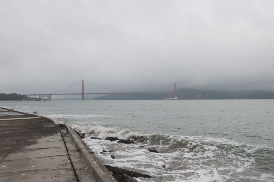 golden-gate-bridge-from-the-shore-very-cloudy-day.webp